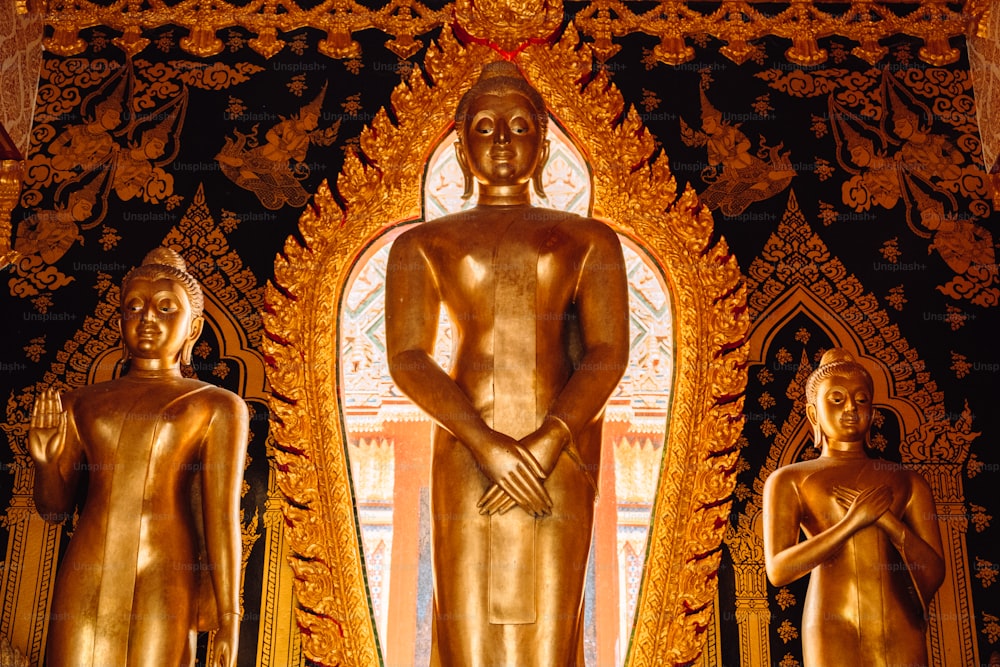 a golden statue of a man and a woman