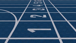 una pista de atletismo azul con una flecha blanca apuntando a la izquierda