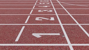 a red running track with white numbers on it