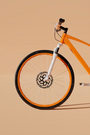 an orange bike with a black and white emblem on the front wheel