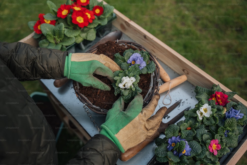 a person with gardening gloves and gardening gloves on