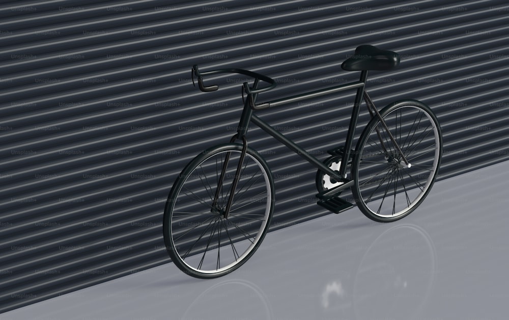 a black bike is leaning against a wall
