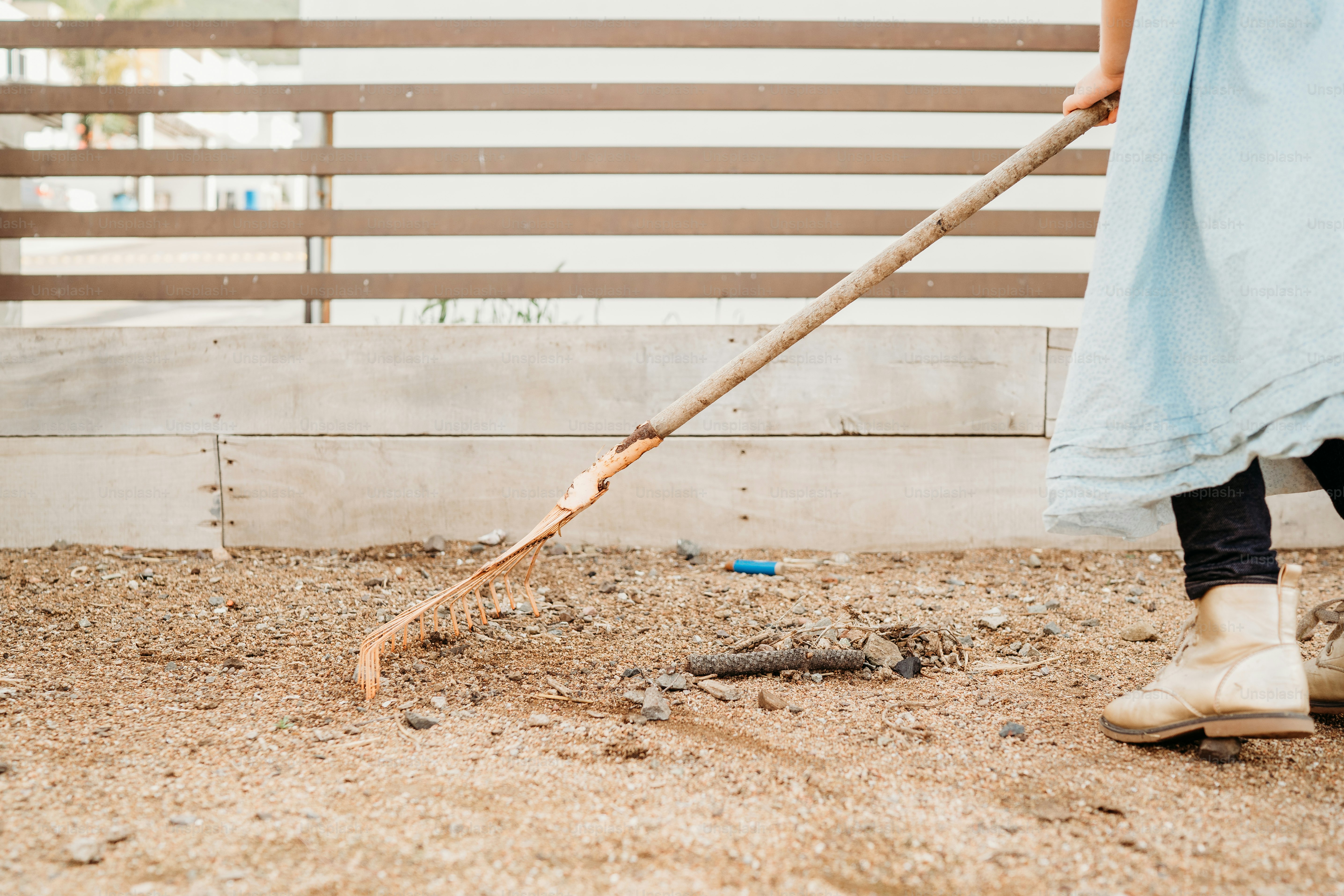 a person with a long stick in their hand