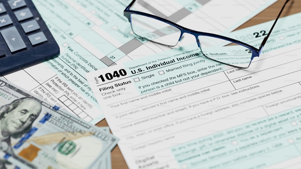 a pair of glasses sitting on top of a tax form