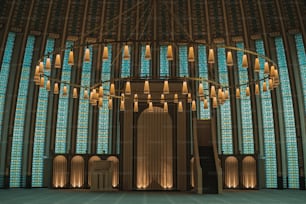 a large chandelier in front of a large stained glass window