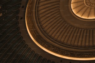 the ceiling of a building with a circular light