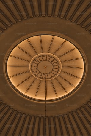 a ceiling with a clock in the middle of it