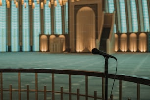 a microphone sitting in front of a large building