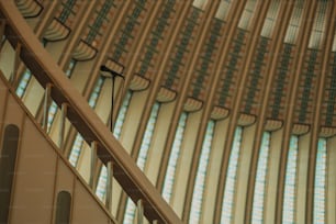 a microphone on a stand in front of a wall of windows