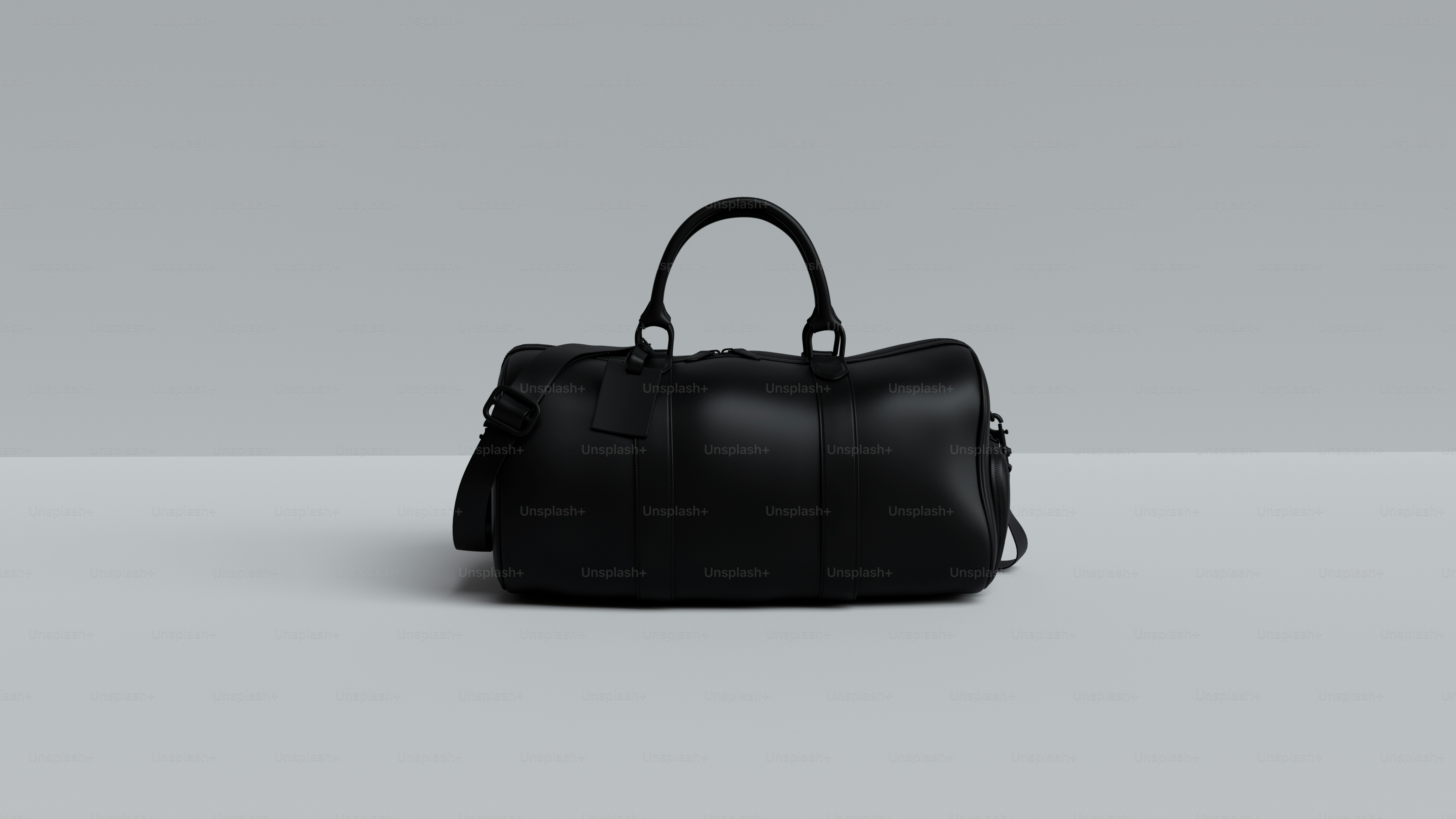 a black leather bag sitting on top of a table