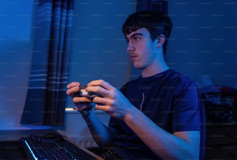 a man sitting in front of a laptop computer