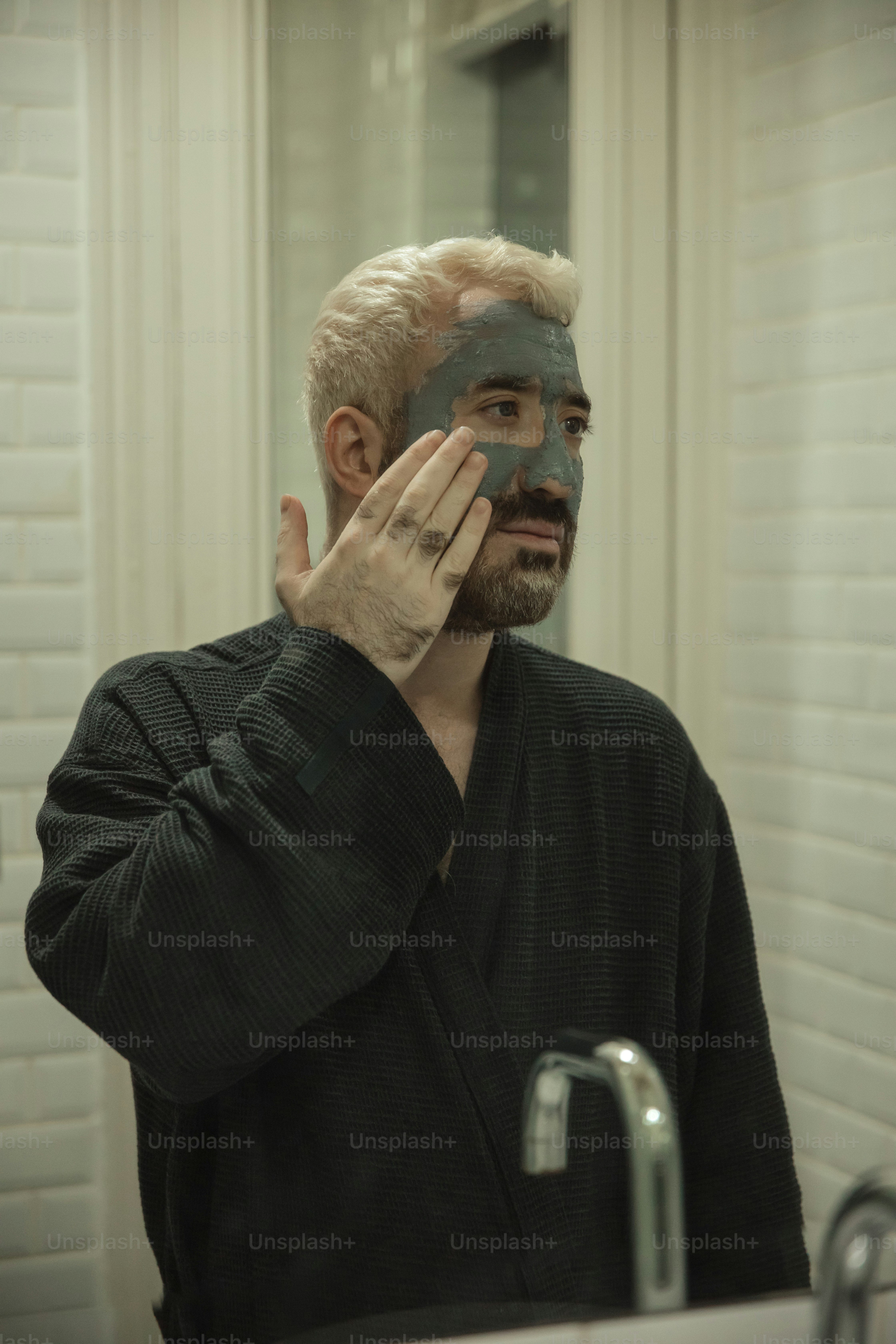 a man with a facial mask covering his face