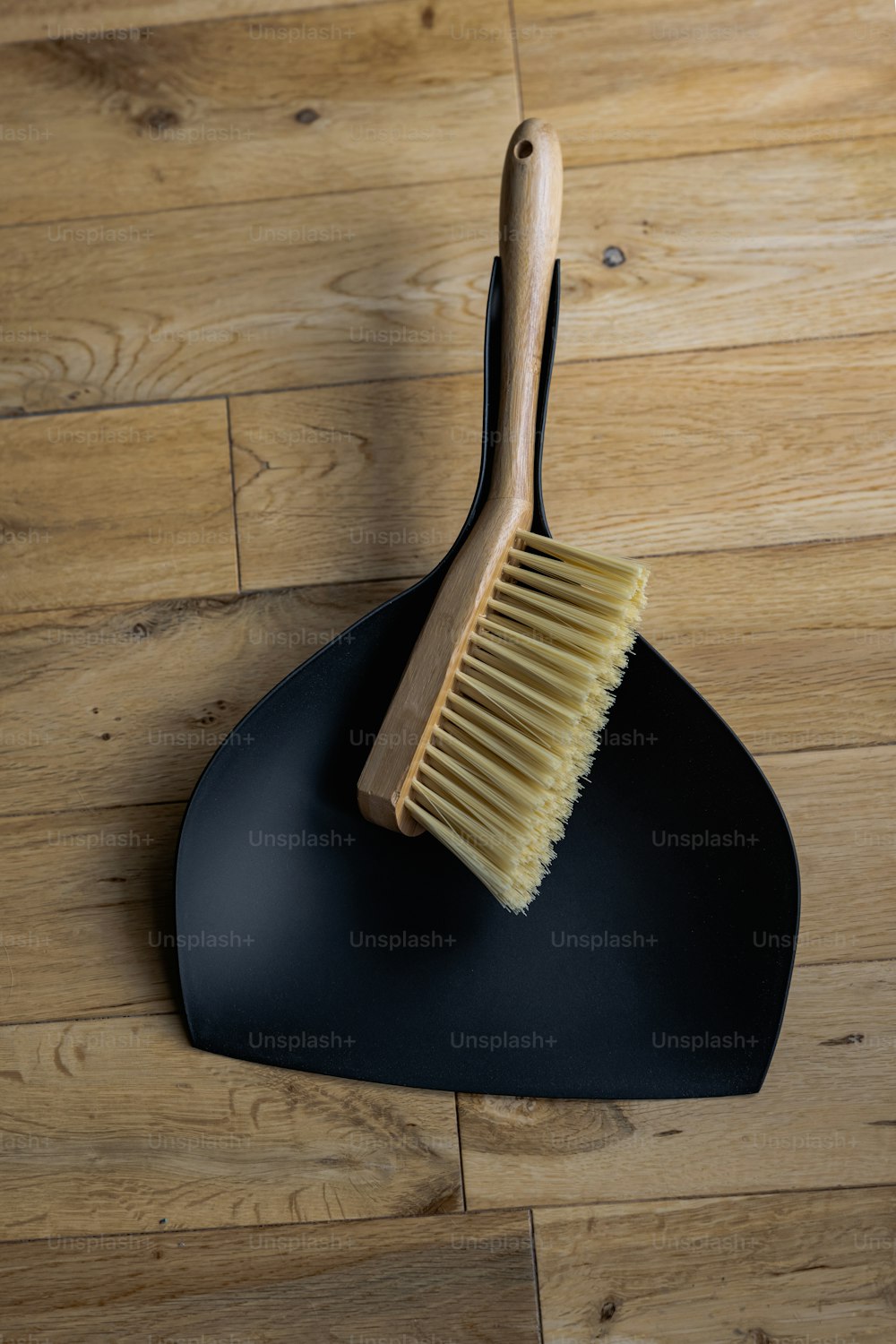 a wooden brush sitting on top of a black holder