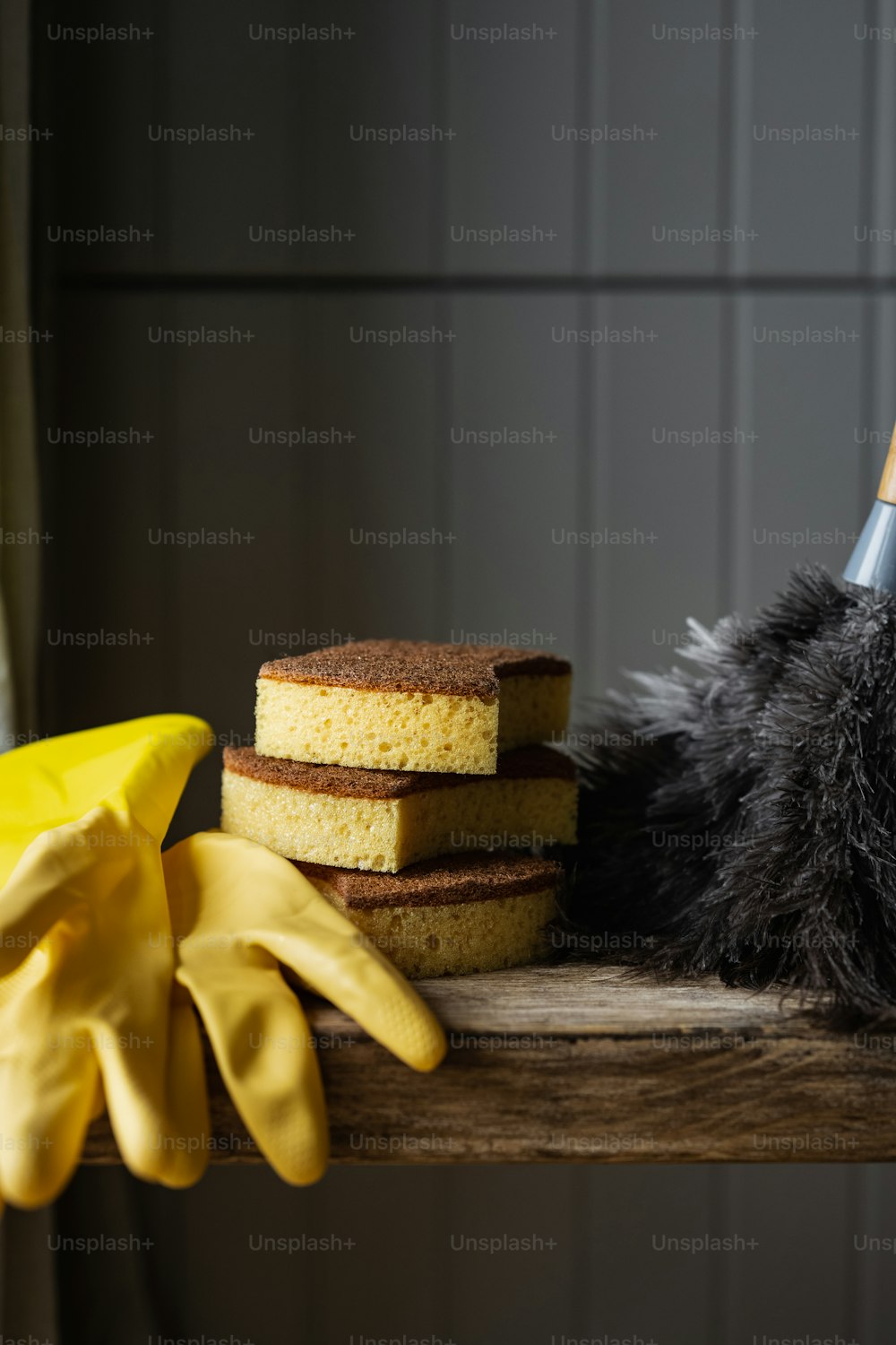 a pile of yellow sponges next to a pile of black sponges