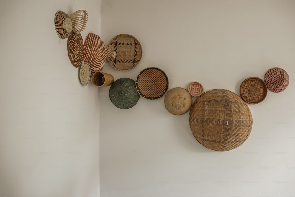 a number of baskets hanging on a wall