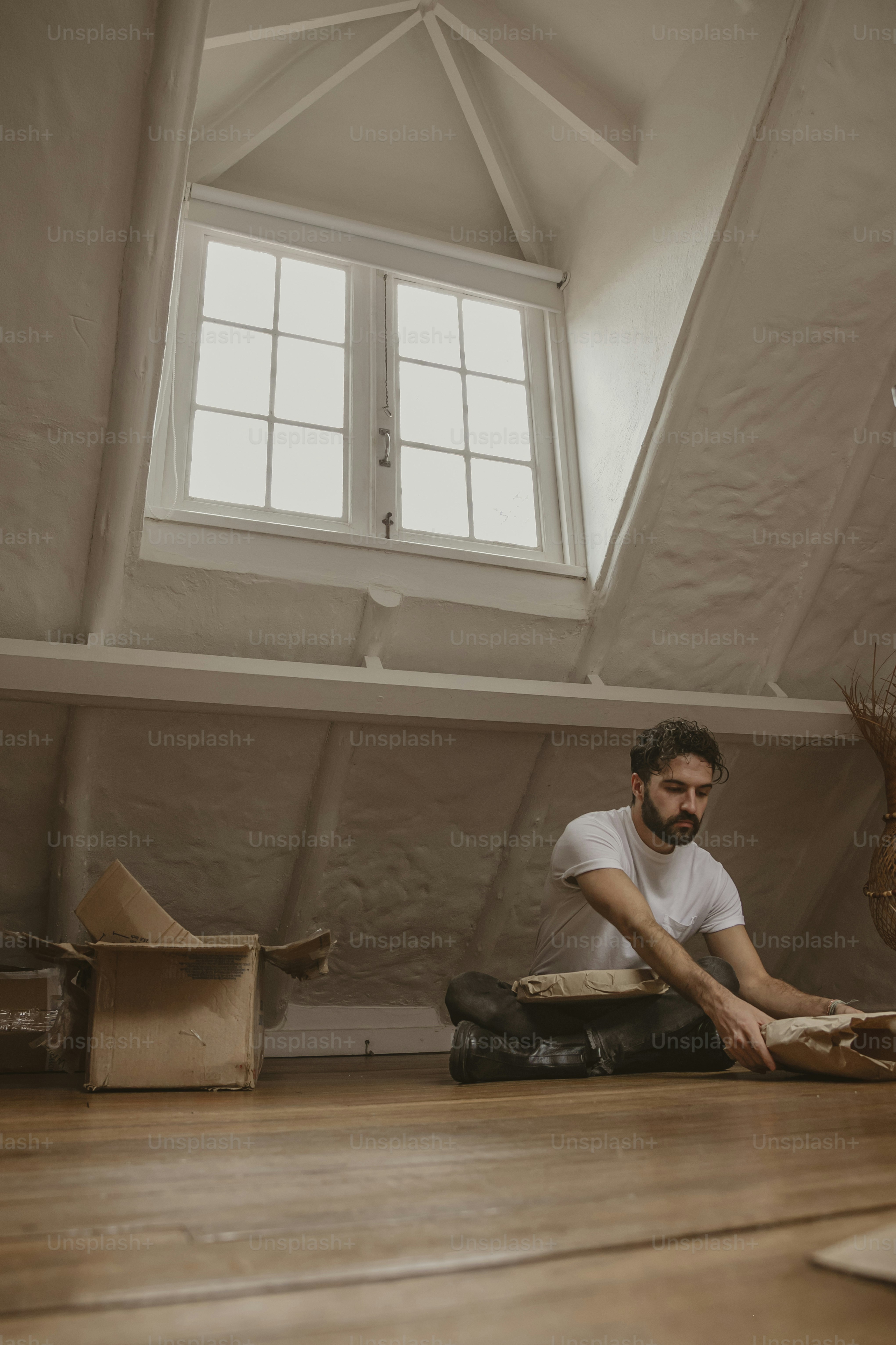 a man sitting on the floor in a room