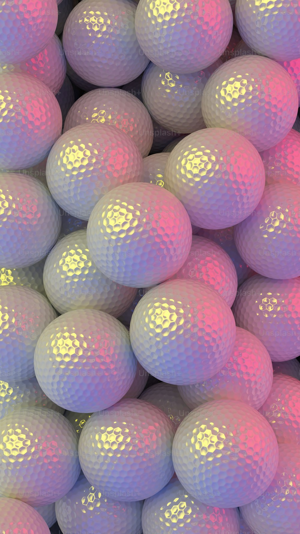 a pile of pink and white golf balls