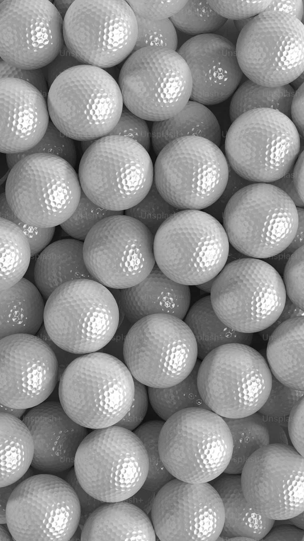 a pile of white golf balls sitting on top of each other