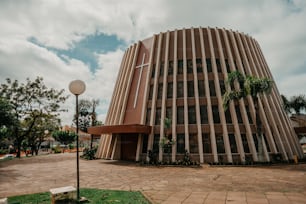 a tall building with a circular design on top of it