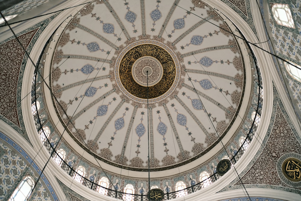 the ceiling of a building with a circular design