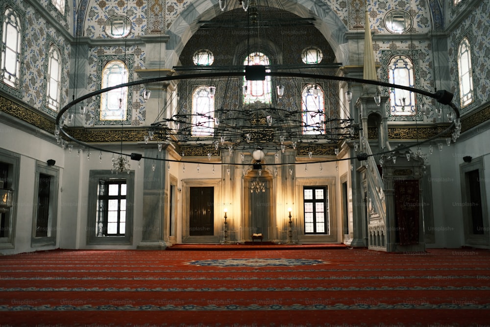 the inside of a building with a red carpet