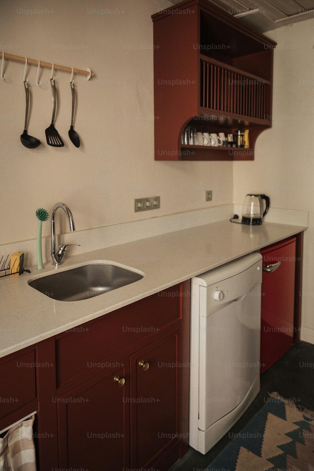 a kitchen with a sink and a dishwasher