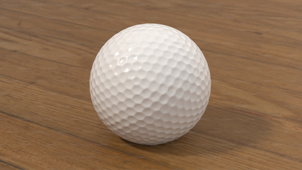 une balle de golf blanche posée sur une table en bois