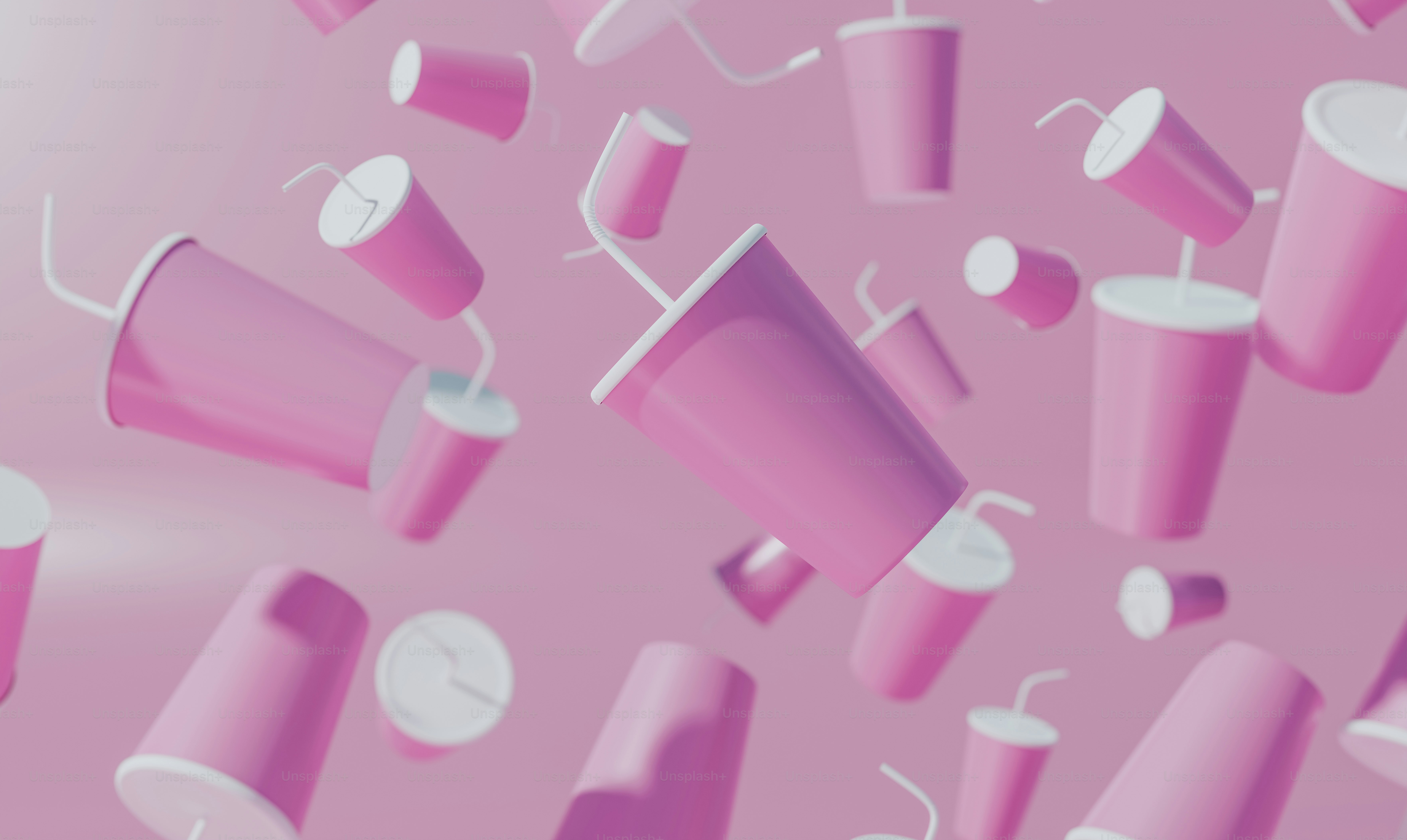a bunch of pink cups floating in the air