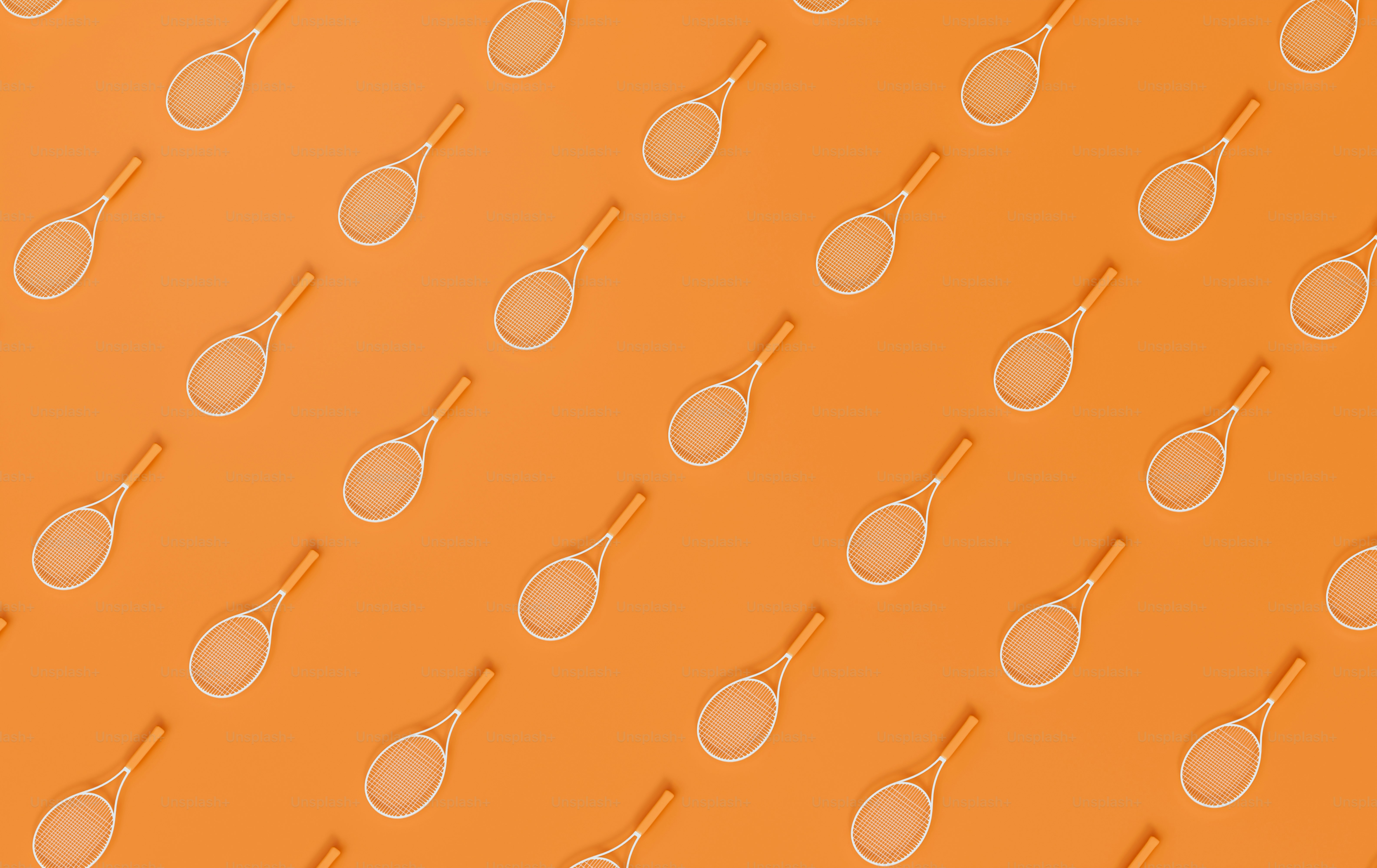 a pattern of tennis rackets on an orange background