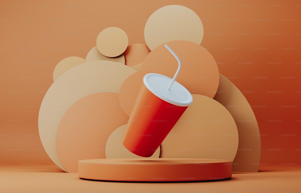 a red cup with a straw in it sitting on a stand