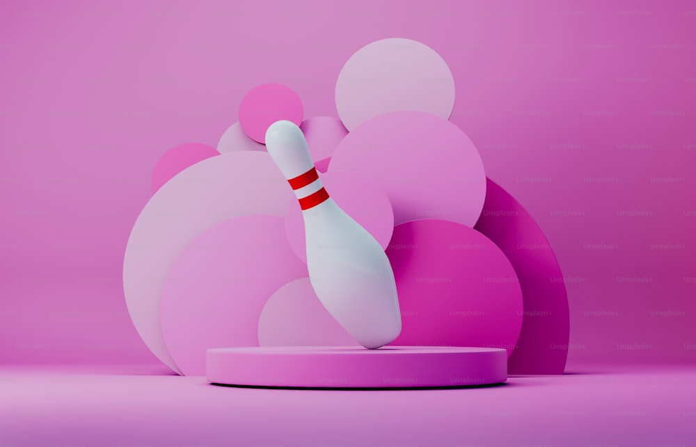 a white bowling ball hitting a pink bowling pin