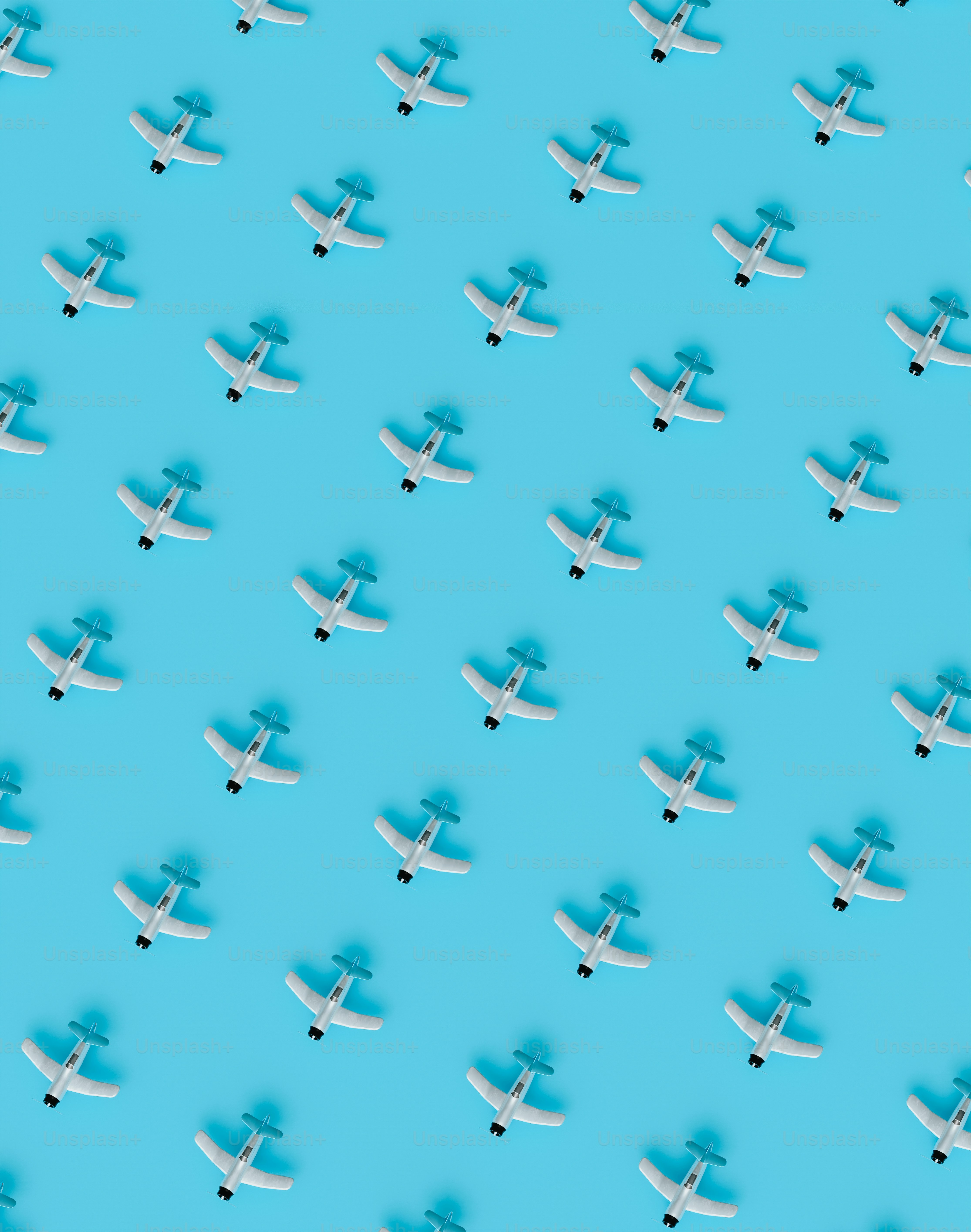 a group of airplanes flying through a blue sky