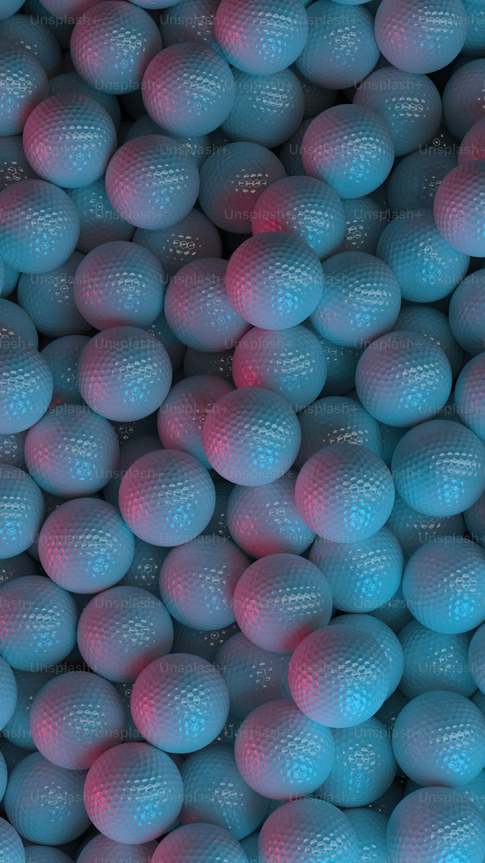 a large group of blue and pink balls