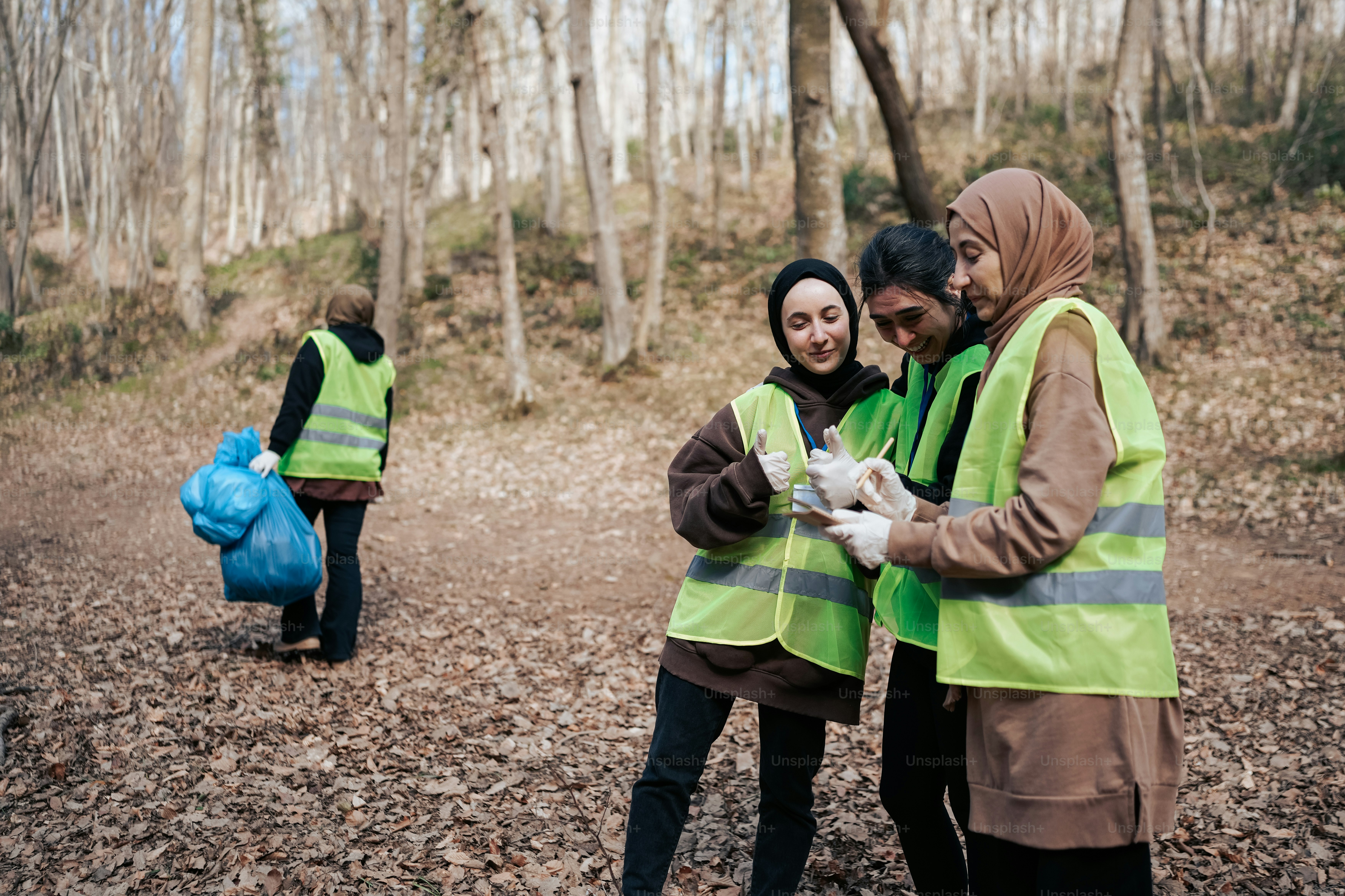a group of people standing in a forest