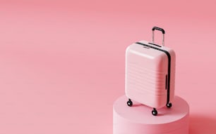 a white suitcase sitting on top of a pink pedestal