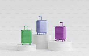 three pieces of luggage sitting on top of pedestals