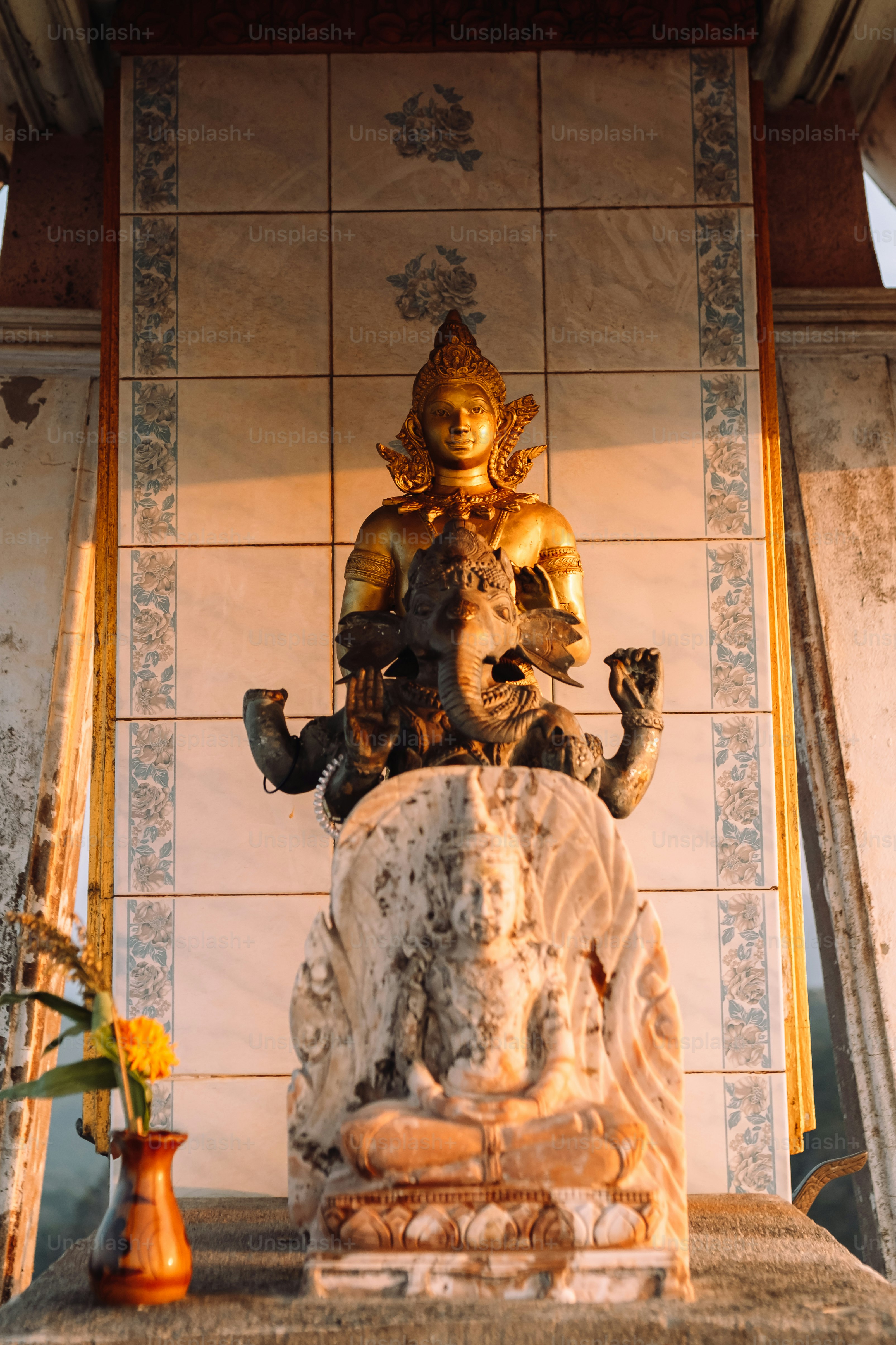 a statue of a person sitting on top of a table