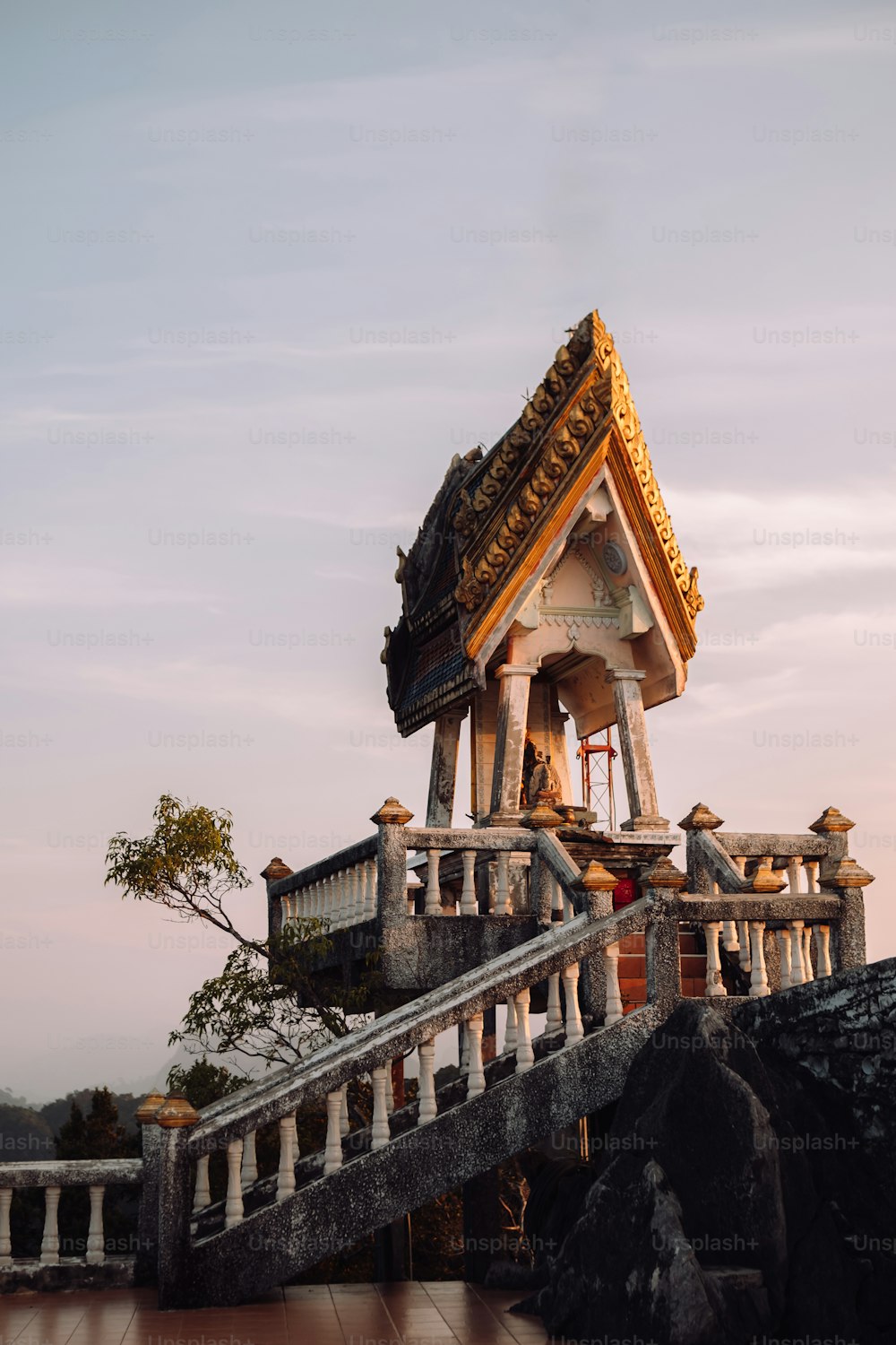 a large bell tower sitting on top of a wooden staircase