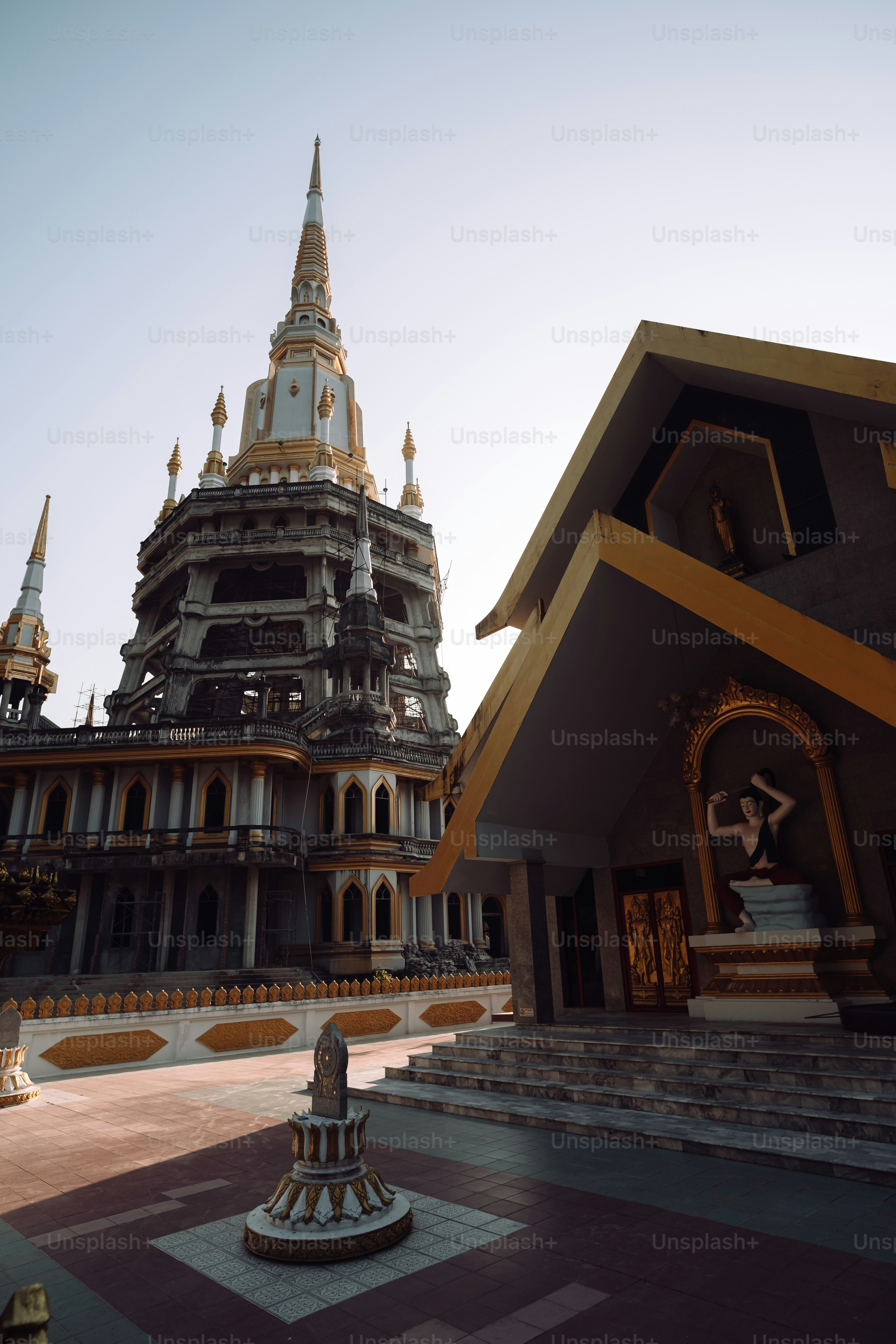 a very tall building with a clock on it's side