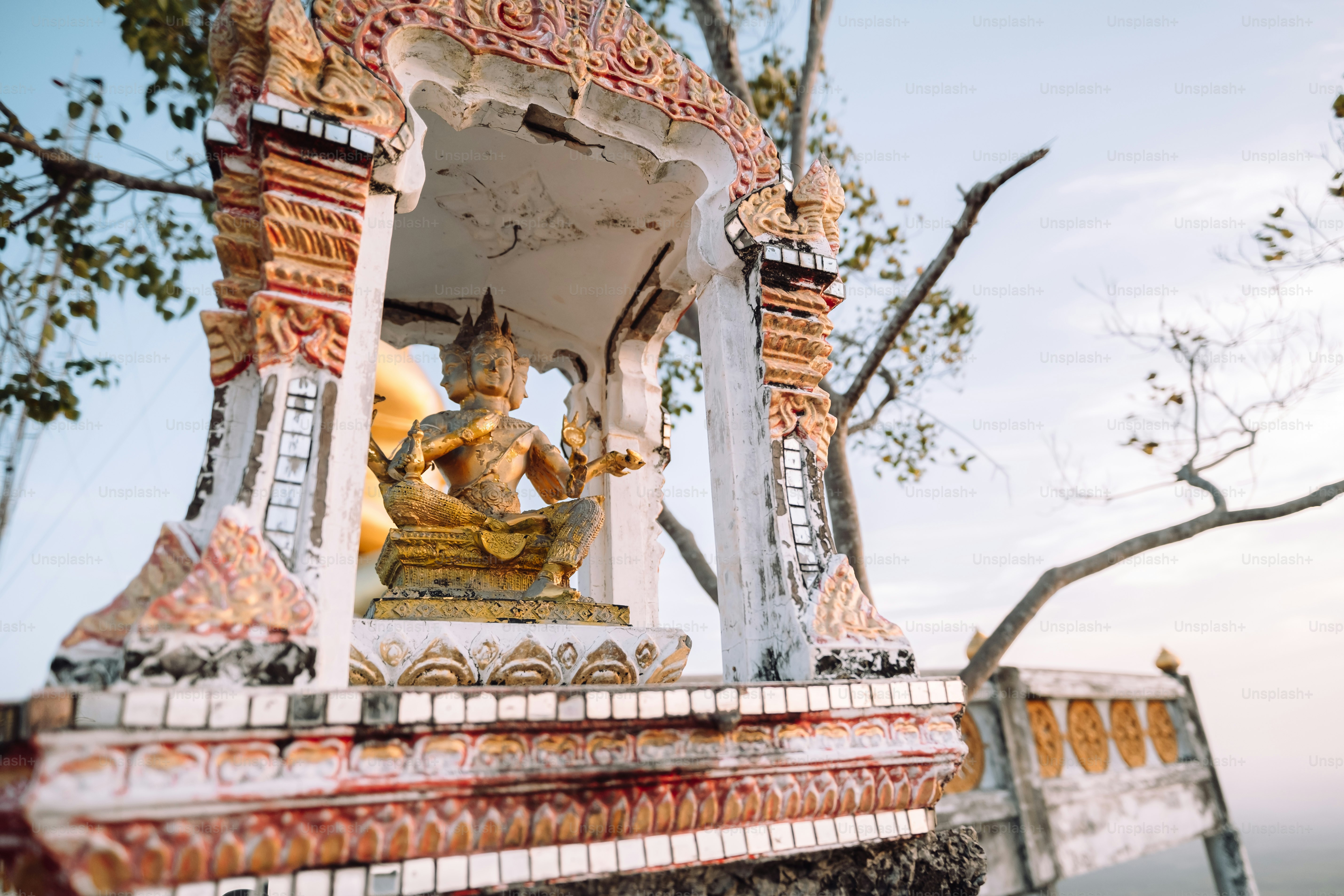 a statue of a person sitting on a bench
