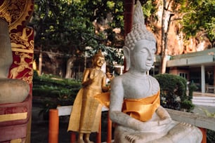 a statue of a person sitting on a bench