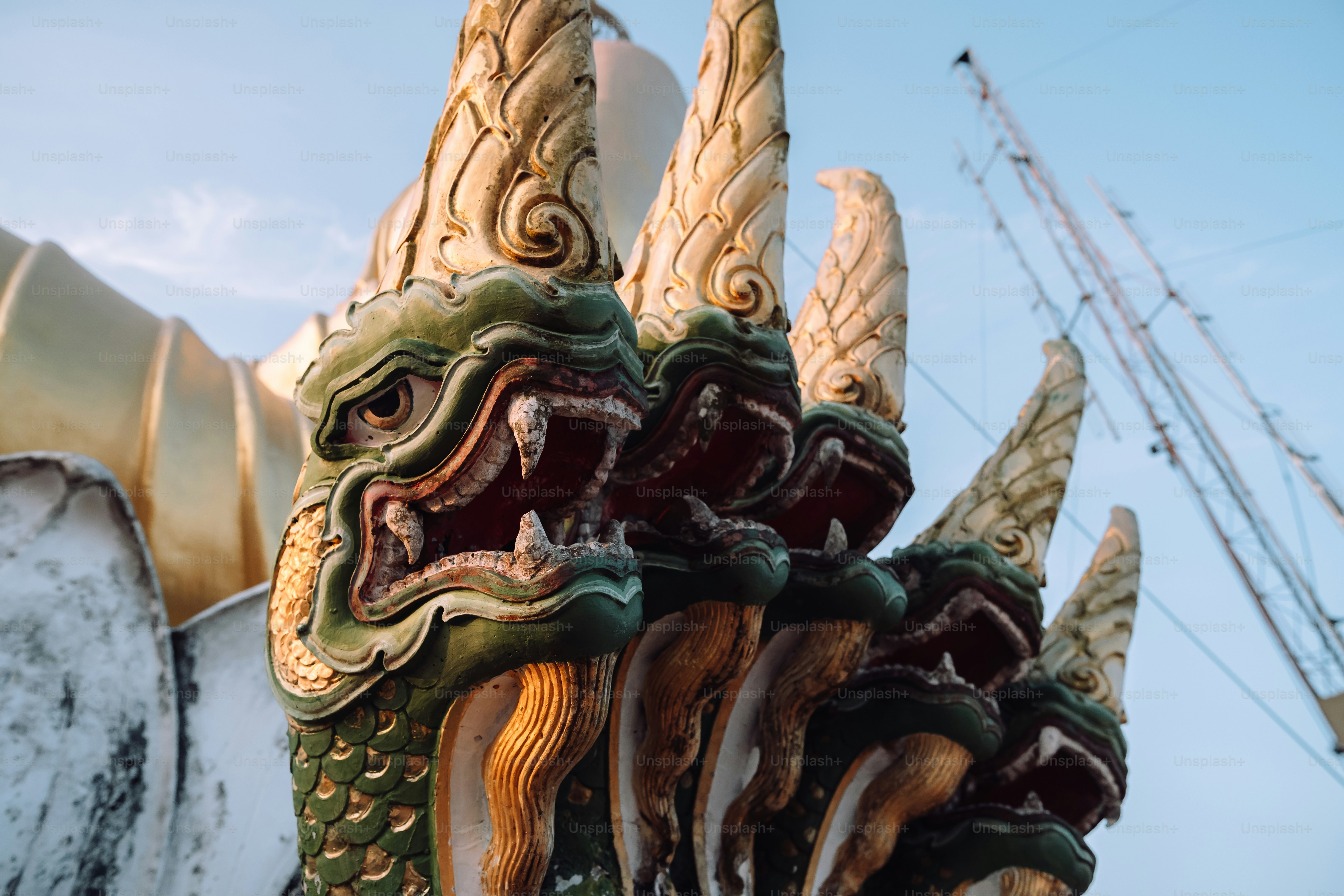 a close up of a dragon head on a building