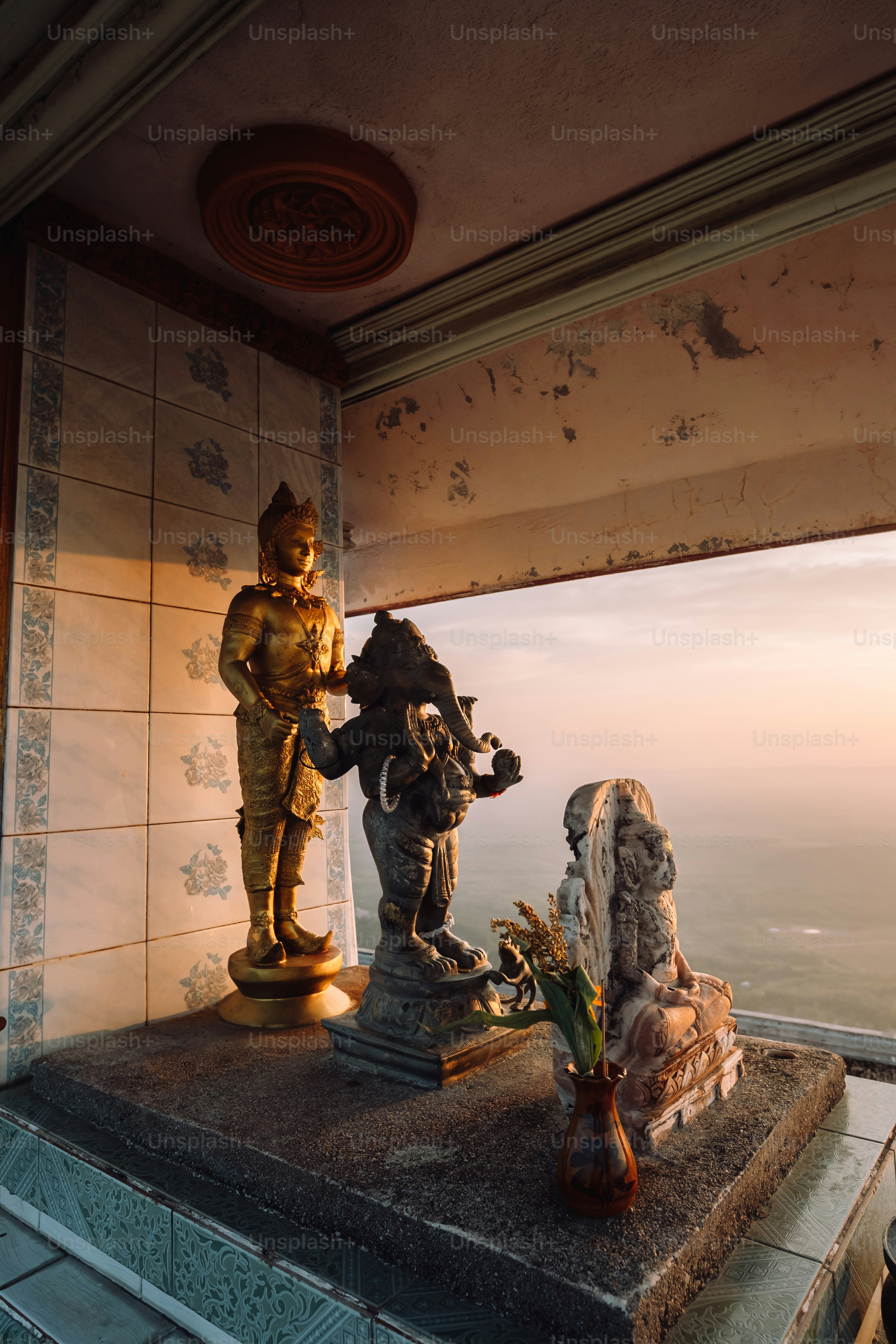 a statue of a man and a woman on a ledge