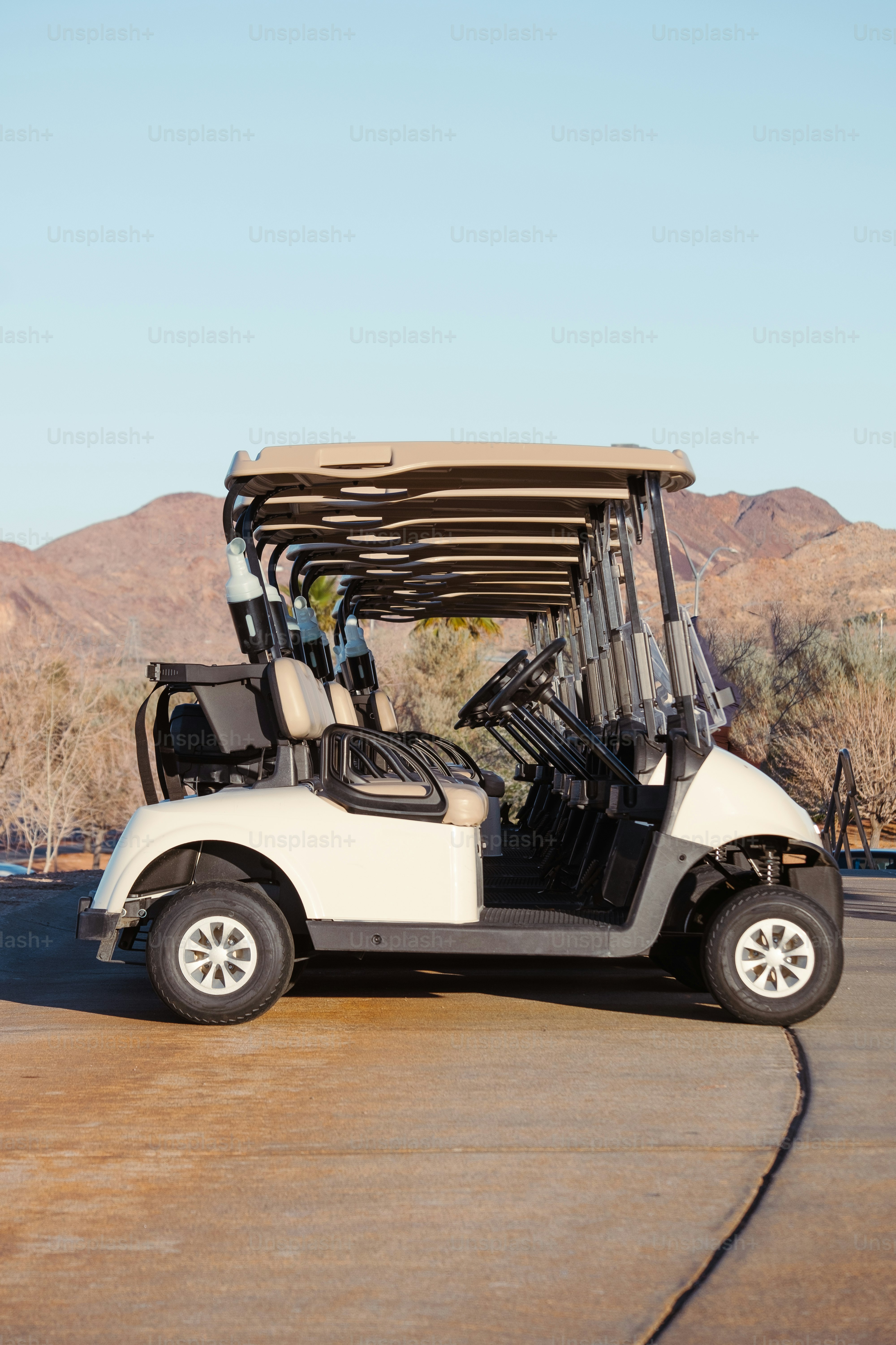 a white golf cart parked in a parking lot