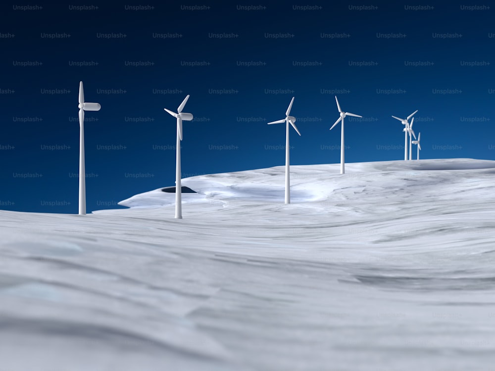 a row of wind turbines on a snowy hill