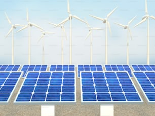 a row of solar panels with windmills in the background