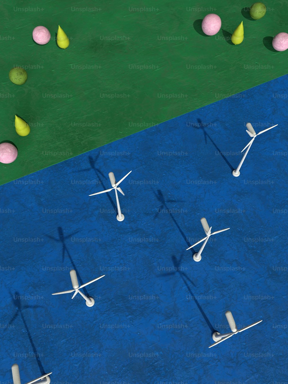 a group of windmills on a blue ground