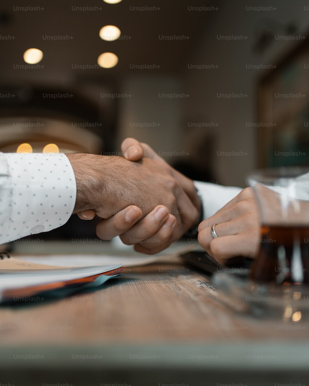 a close up of two people shaking hands