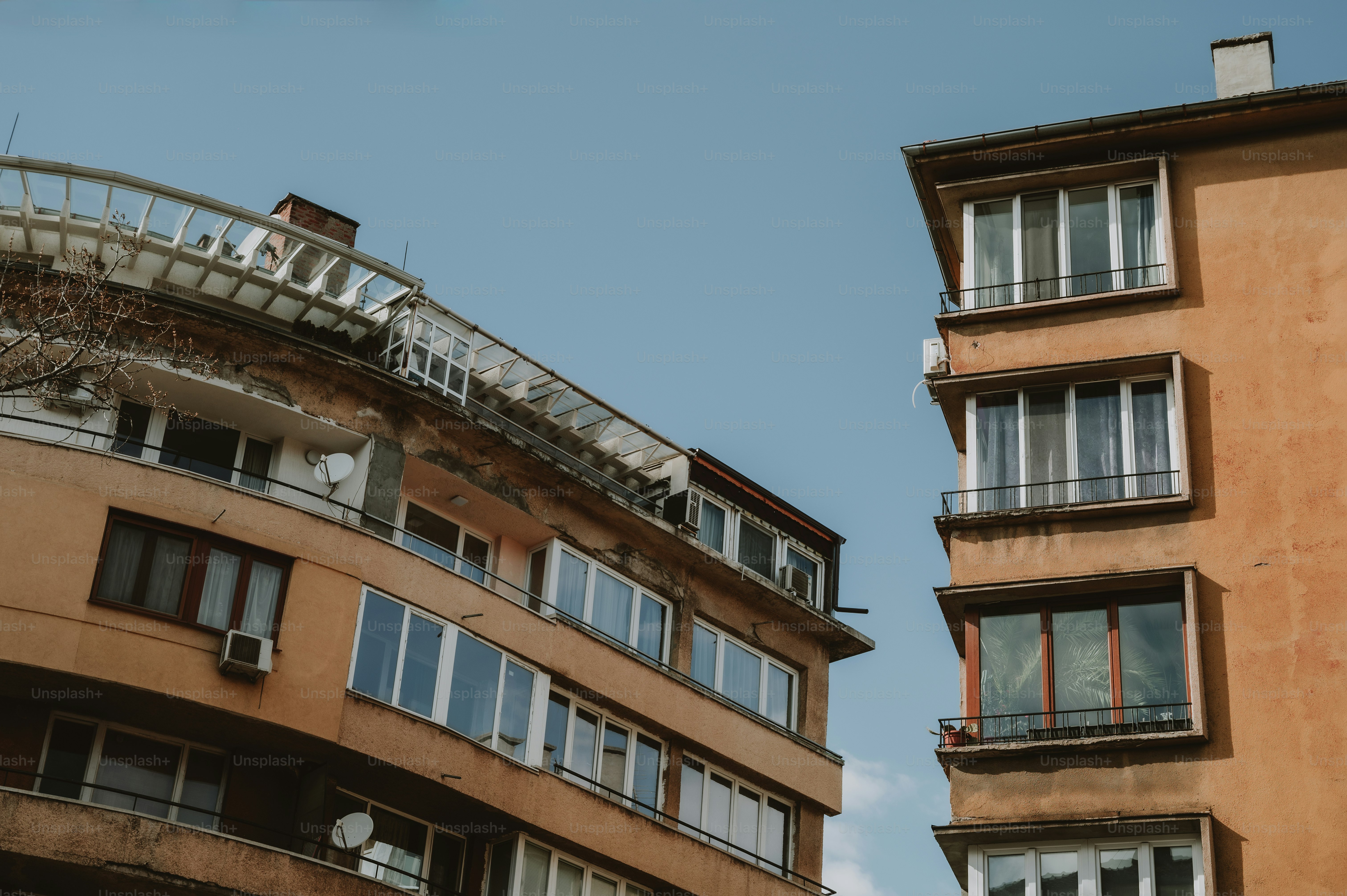 A couple of buildings that are next to each other photo – Building ...