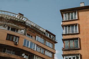 a tall building next to a very tall building